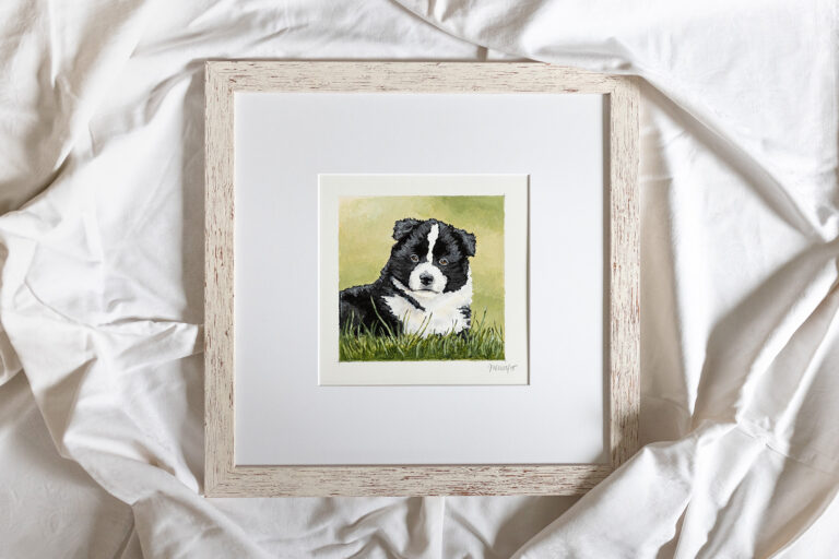 Gerahmtes Acrylgemälde eines Border Collie Welpen, das auf weißer Bettwäsche liegt